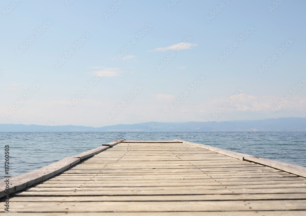 Solitude wooden pier and blue sky