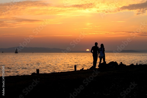 Couple on background of sea sunset