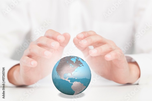 Hand and globe.