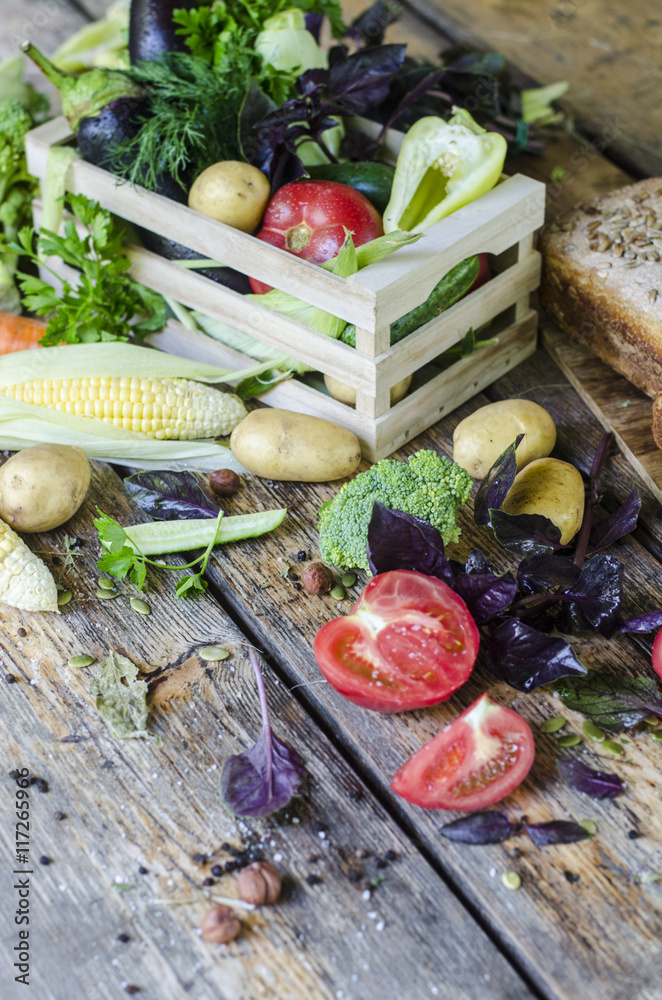 Fragrant rye bread with vegetables on a wooden table Fragrant rye bread with vegetables on a wooden table