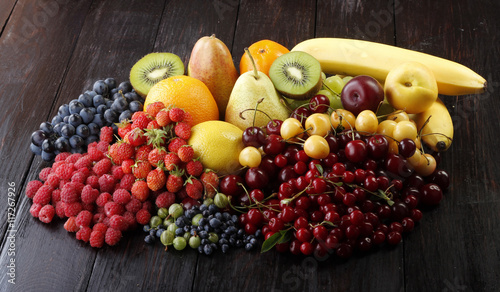 berries and fruits on wooden  background