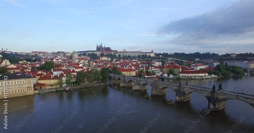 Aerial camera slowly moves towards Prague castle, the Charles Bridge and River Vltava are in shot. Shot at dawn in 4K Aerial camera slowly moves towards Prague castle, the Charles Bridge and River Vltava are in shot. Shot at dawn in 4K