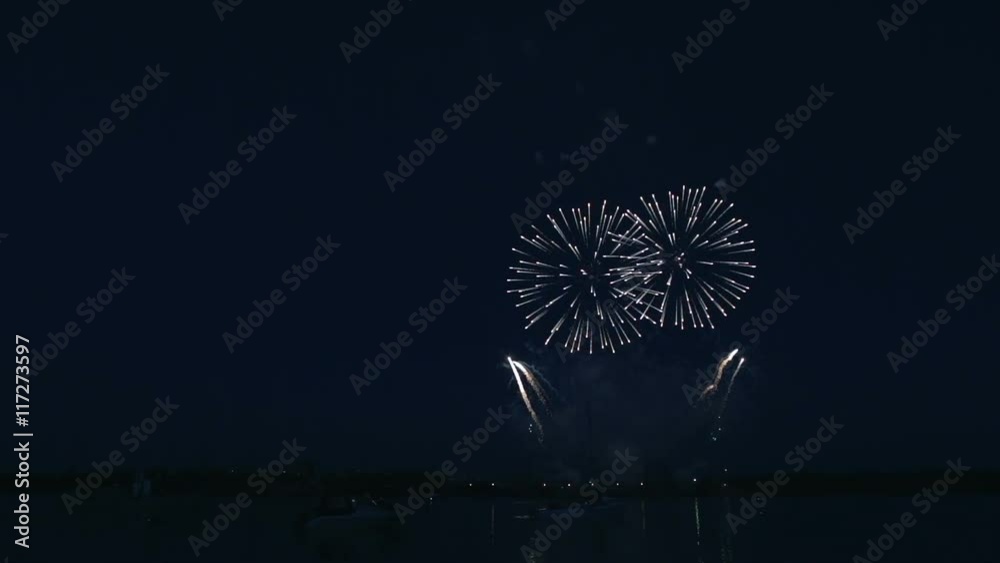 Beautiful fireworks under the river on background of black sky. Beautiful fireworks under the river on background of black sky.
