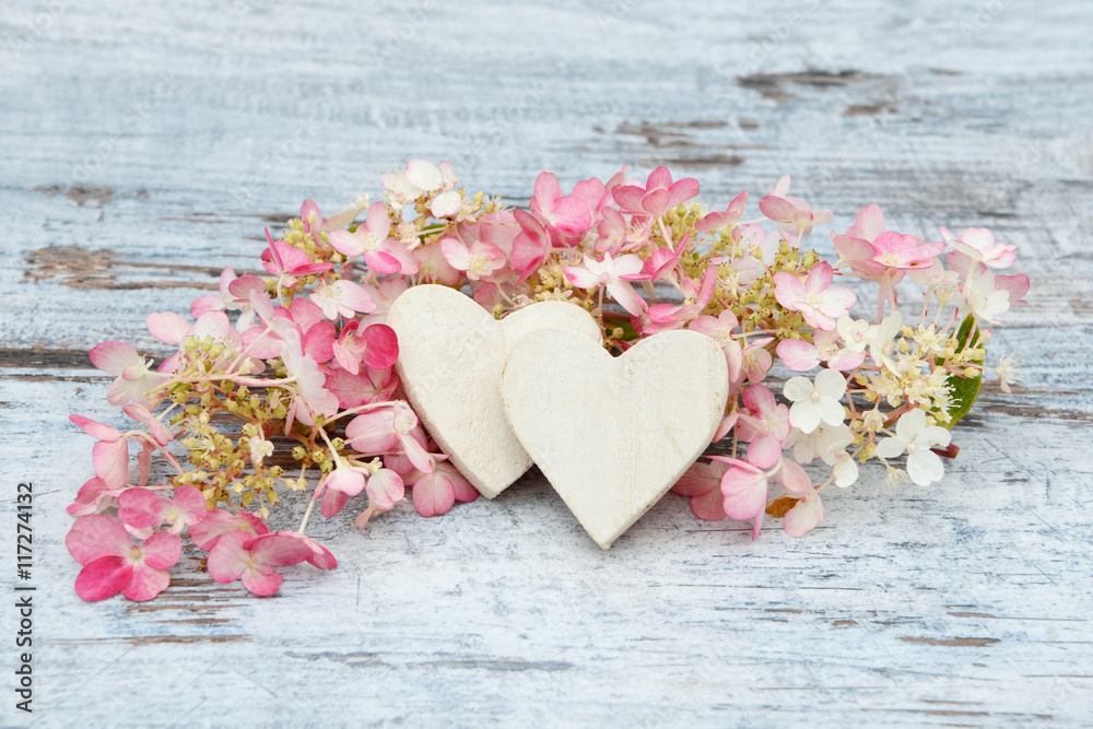 flower and wooden heart lying on wood flower and wooden heart lying on wood