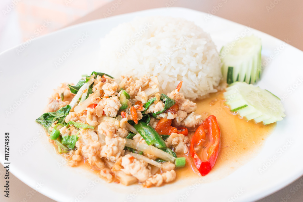 Rice topped with stir-fried pork and basil