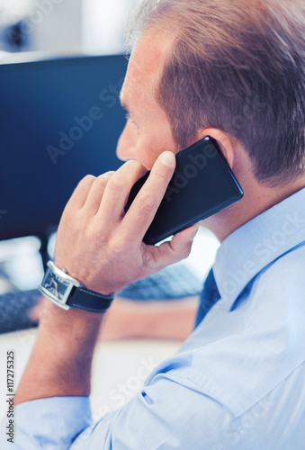 businessman with smartphone in office