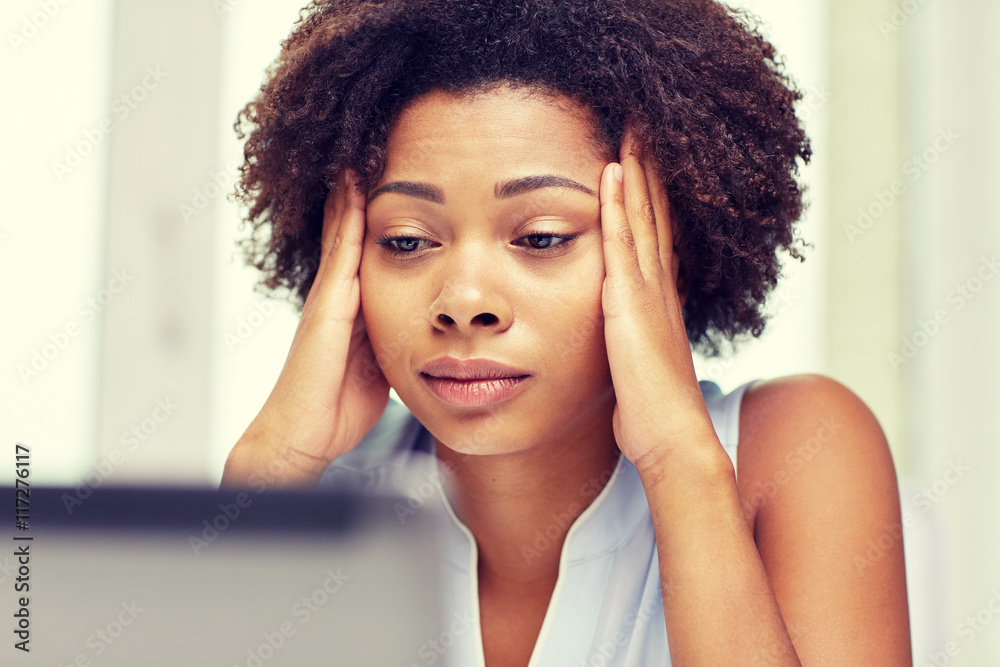 african woman with laptop at office african woman with laptop at office