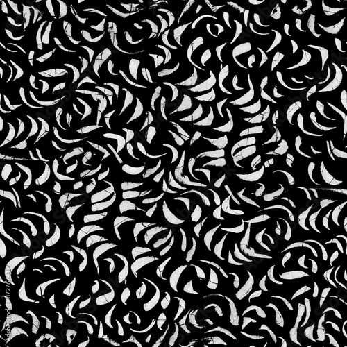 Abstract seamless texture with chaotic strokes. Chaotic strokes. Graphic background. White brush strokes on a black background. Seamless texture. Seamless background. Repeated pattern.