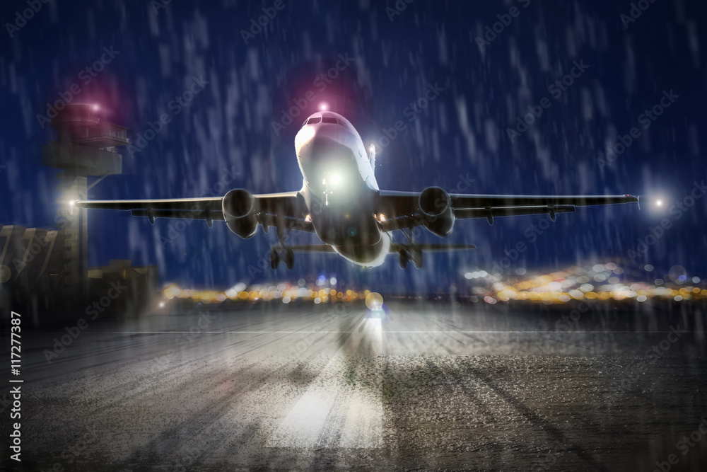 airplane starting in an storm in the evening airplane starting in an storm in the evening