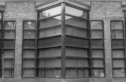 Urban Geometry. Modern architecture black and white  concrete and glass.  Abstract architectural design. Inspirational  artistic image BW. Artistic image and point of view. Reflections in window.