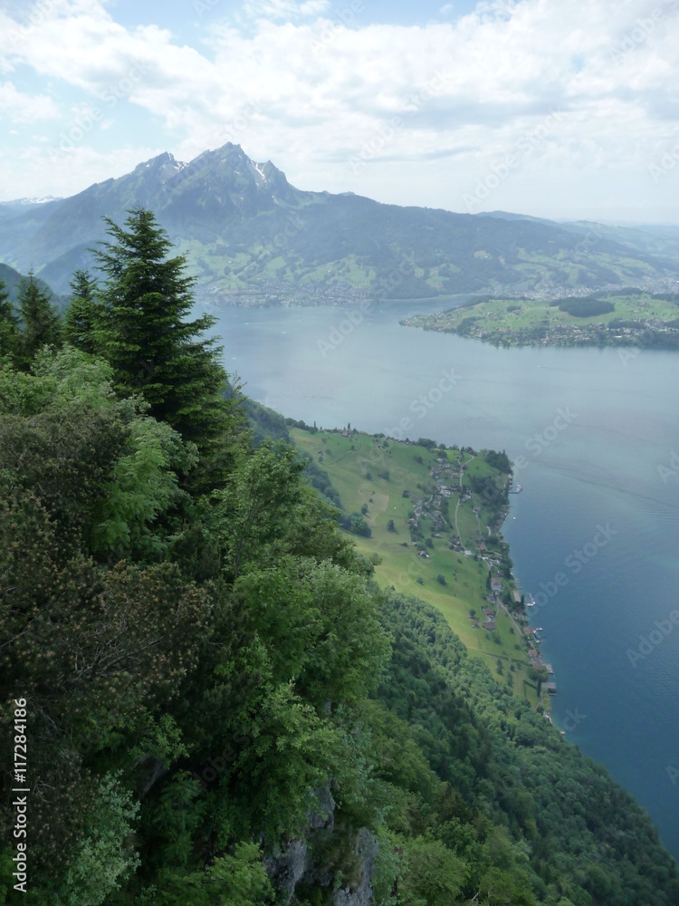 View down onto Lake Luzern from Burgenstock clifftop path, with Pilatus mountain in the distance