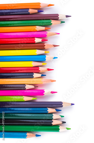 Colored pencils isolated on a white background closeup
