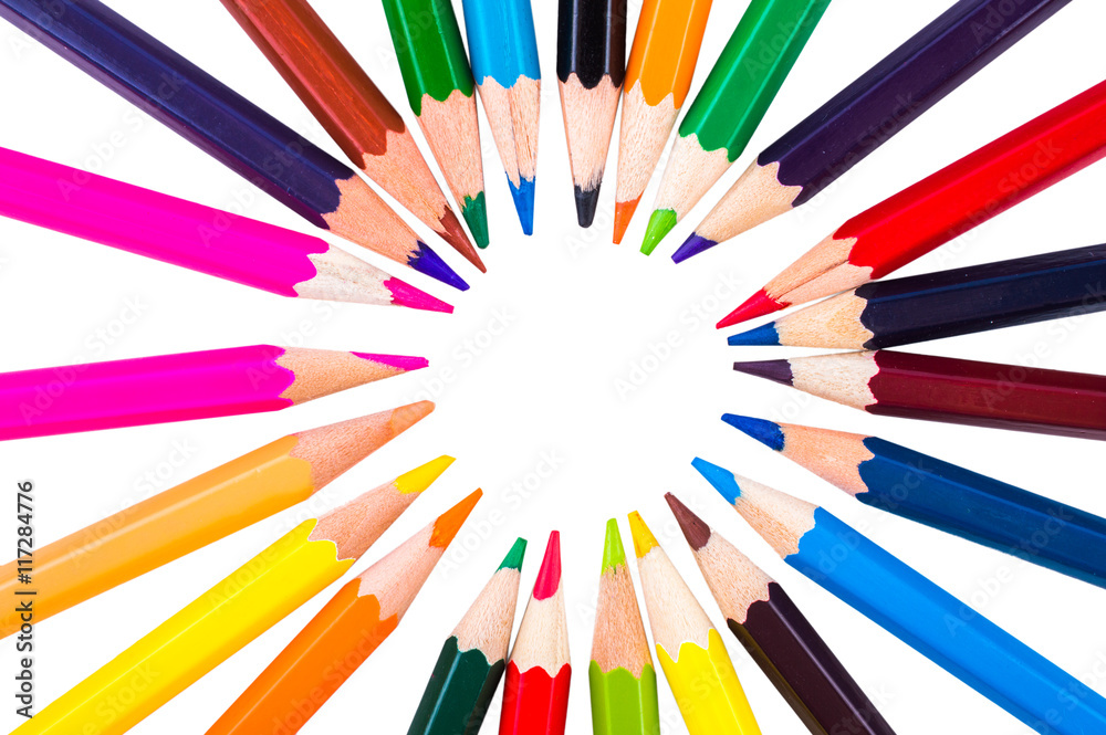 Colored pencils in a circle on a white background closeup Colored pencils in a circle on a white background closeup