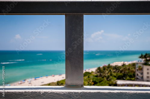 Image from balcony with tropical beach background. Abstract image of beach and sand from condo terrace view. Ocean and beach view from high-rise building. 