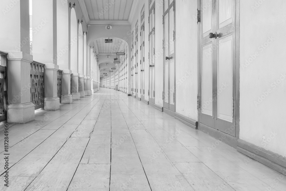 Wooden pathway / View of wooden pathway of retro building. Black and white tone.