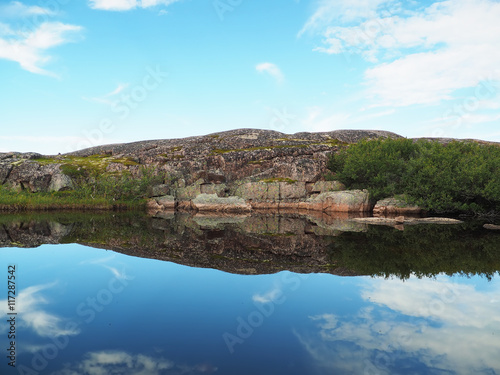reflection in the lake. The coast of the Barents Sea