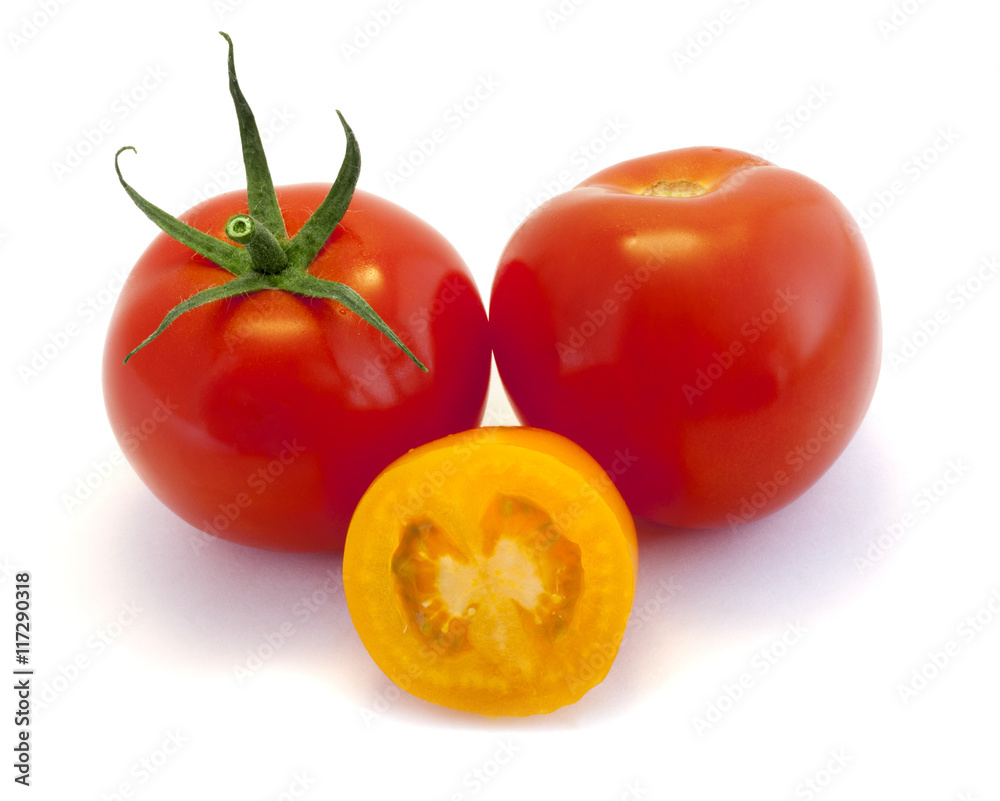 Red and yellow tomatoes on white background Red and yellow tomatoes on white background