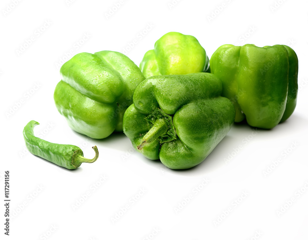 fresh green bell peppers and basil on a white background fresh green bell peppers and basil on a white background