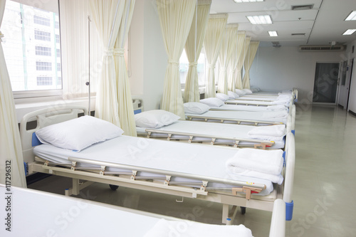 Hospital ward with beds and medical equipment photo