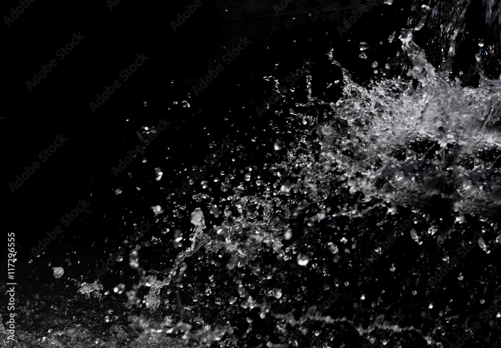 Naklejka premium Water splash on black background