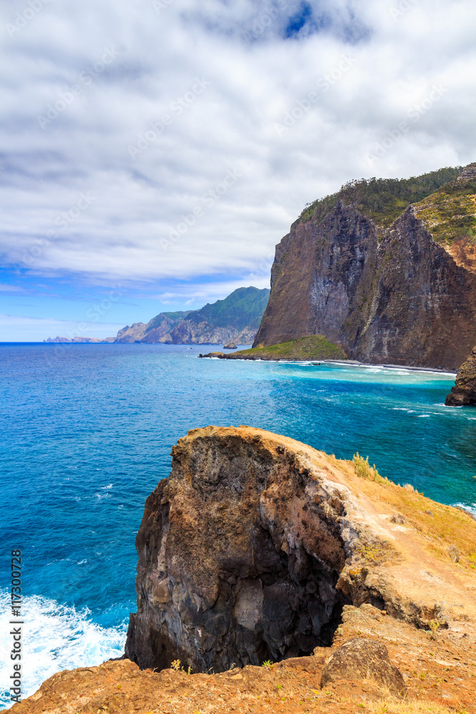 View of beautiful mountains and ocean on northern coast near Guindaste, Faial, Portugal