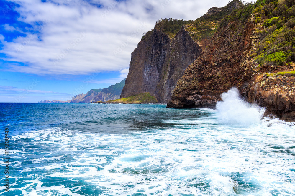 Ocean waves crashing against the rocks, north coast of Madeira island, Guindaste, Faial, Portugal.