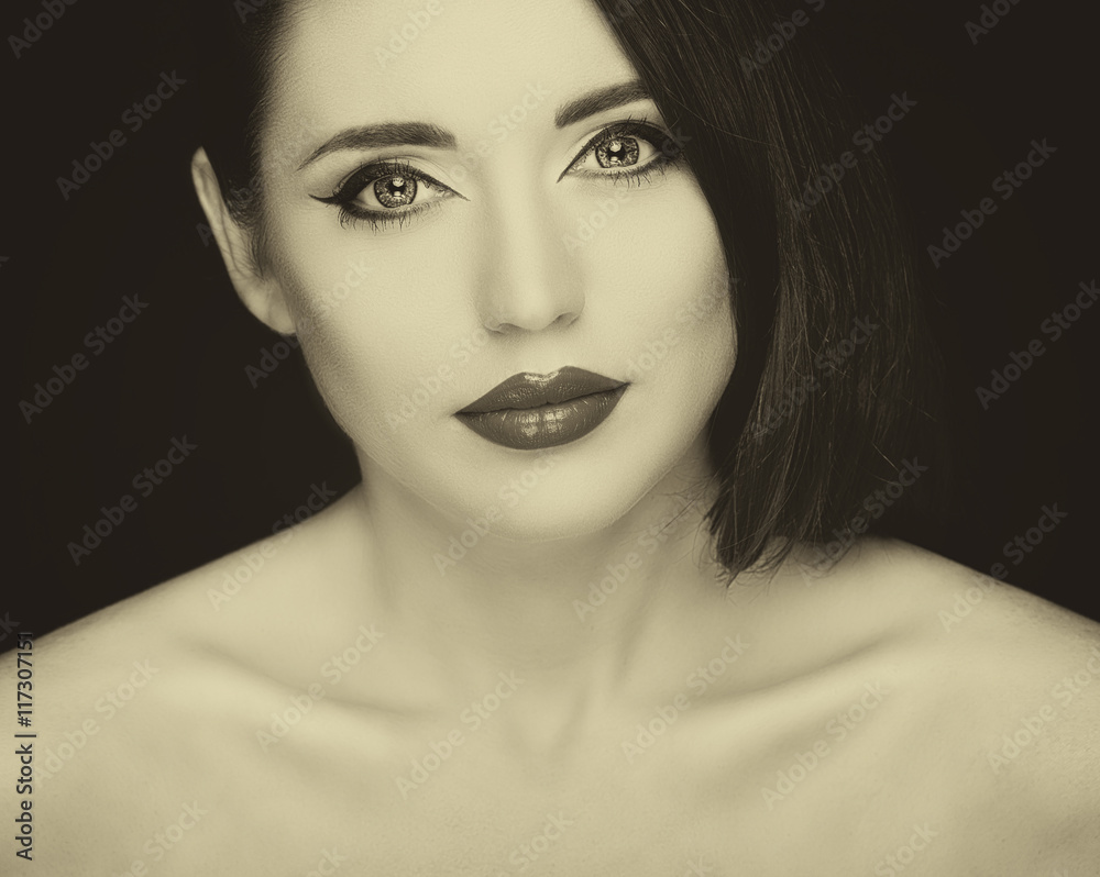 Gorgeous young woman with long eyelashes. Perfect makeup. Vintage style Gorgeous young woman with long eyelashes. Perfect makeup. Vintage style