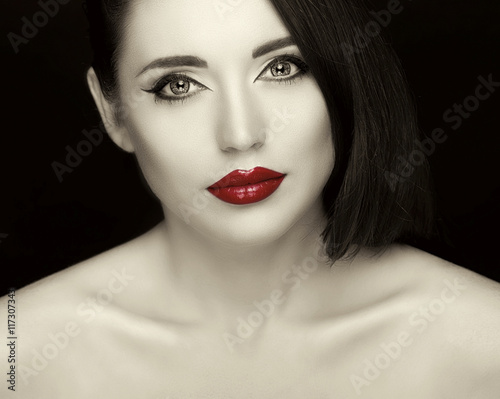 Gorgeous young woman with long eyelashes and red lips. Perfect  makeup.