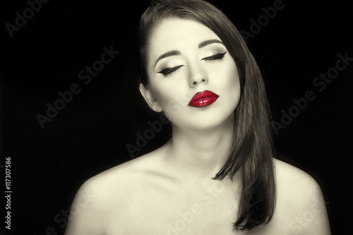 Gorgeous young woman with long eyelashes and red lips. Perfect  makeup.