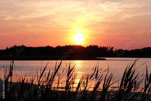 Beautiful shiny sunset on bay