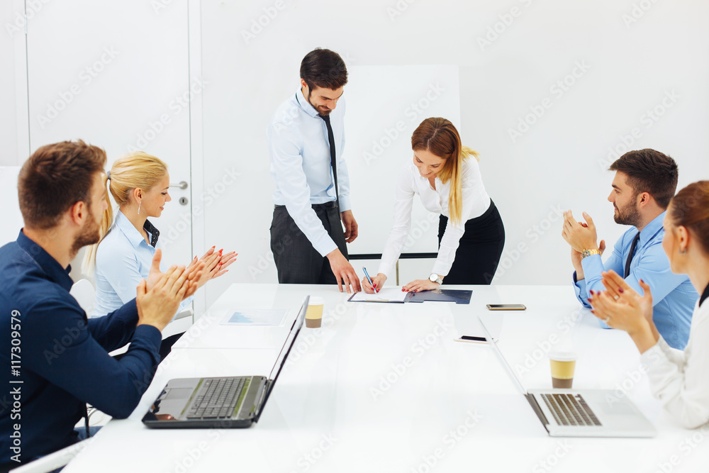 Business people signing the contract Business people signing the contract
