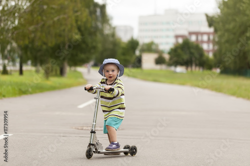 child riding scooter outdoors, active sport kids