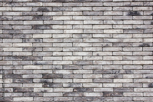 Grunge gray brick wall background.
