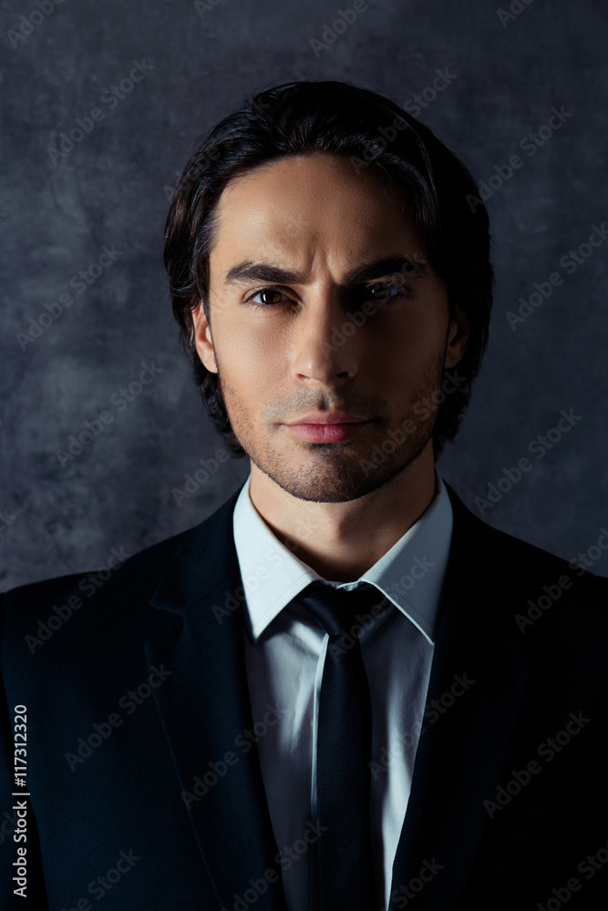 Portrait of handsome harsh hispanic man on gray background Portrait of handsome harsh hispanic man on gray background