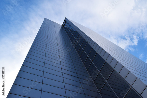 Business office building exterior against blue sky