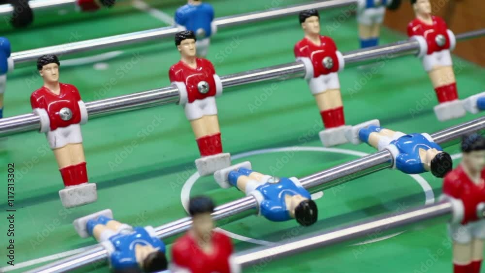 Foosball table-top game for entertainment, active rest at leisure, male hobby Foosball table-top game for entertainment, active rest at leisure, male hobby