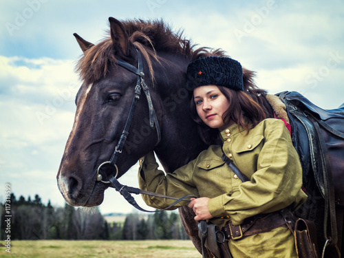 Girl warrior Cossack with a horse. Portrait. © filin28