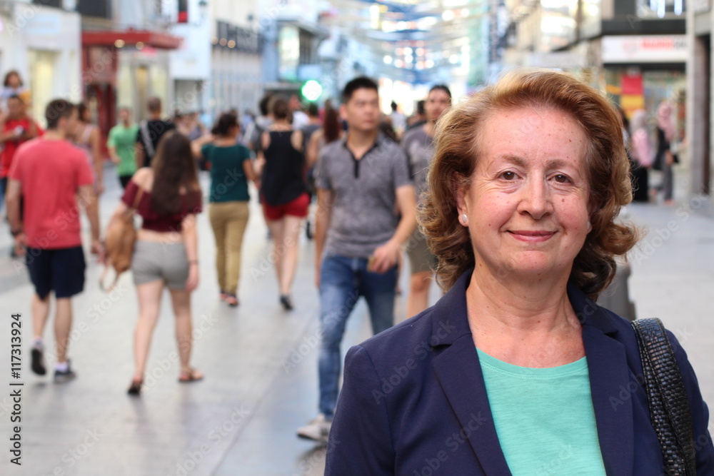 Mature Woman in European Rush Hour Crowded Street 