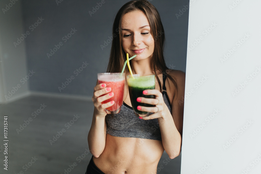 Sexual sports girl drinks smoothie and relaxing after training fitness Sexual sports girl drinks smoothie and relaxing after training fitness