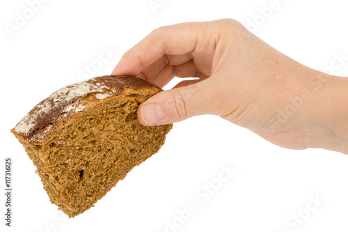 Female hand holds a slice of bread, isolated on white background