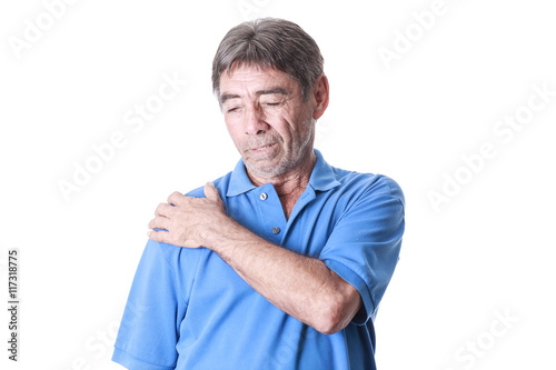 Portrait of elderly man suffering from shoulder pain