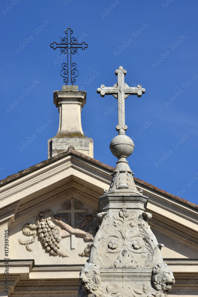 Holy crosses at the top of monuments in Tiberina Island, Rome