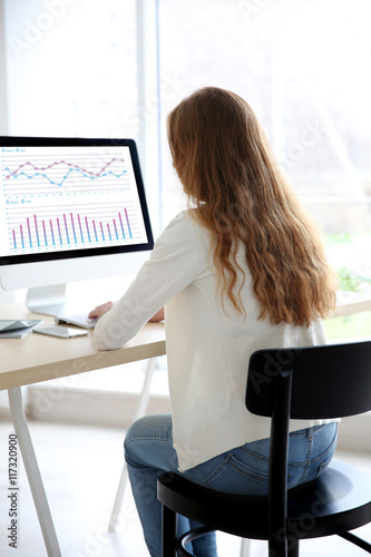 Woman working with computer...