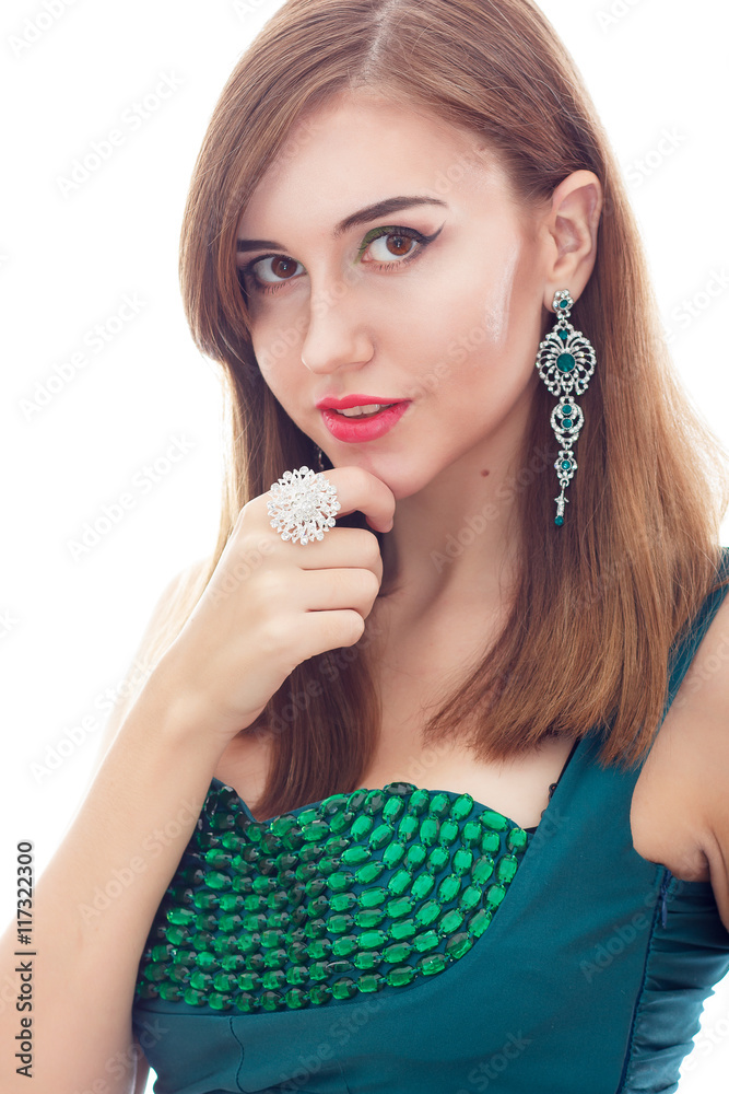 Elegant Posh Woman with Diamond Earrings And Ring. Platinum Jewelry with green And White Diamonds Elegant Posh Woman with Diamond Earrings And Ring. Platinum Jewelry with green And White Diamonds