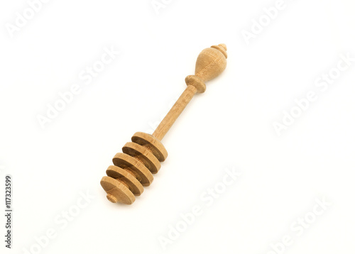 wooden honey stick isolated on white background photo