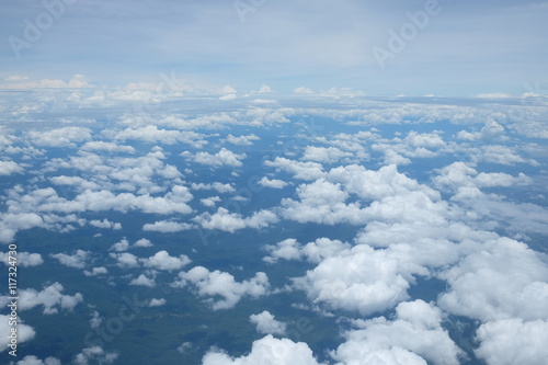 Fototapeta Naklejka Na Ścianę i Meble -  Clouds and sky as seen through window of an aircraft