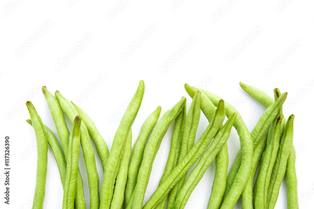 fresh green beans on a white background with copy space