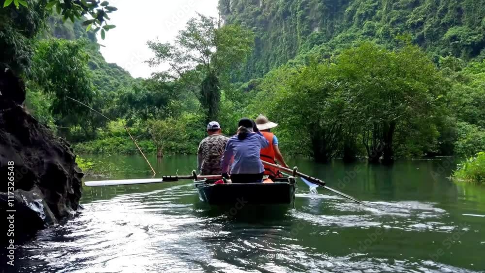 A boat trip through Trang An eco tourism complex in Ninh Binh, Vietnam. A boat trip through Trang An eco tourism complex in Ninh Binh, Vietnam.