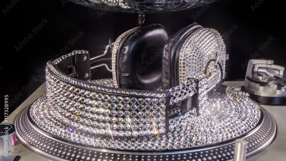daimond headphones and vinyl style dj turntable
