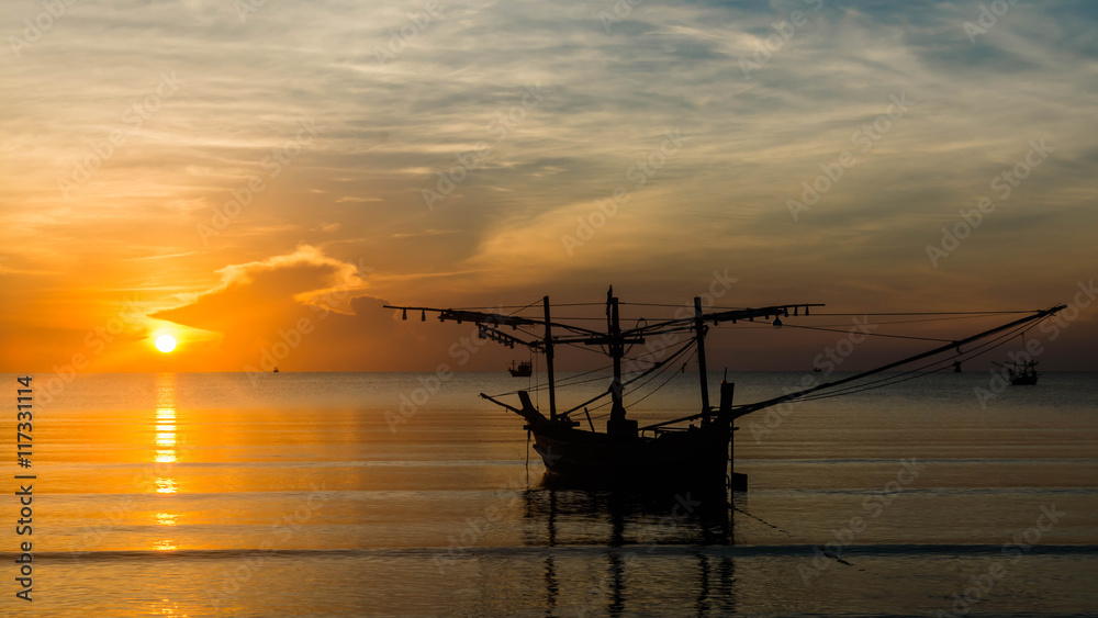 Silhouette of fishing boat at the Sunrise in thailand Silhouette of fishing boat at the Sunrise in thailand